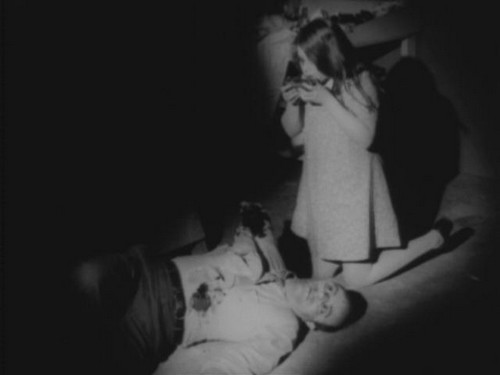 Girl_zombie_eating_her_victim_Night_of_the_Living_Dead_bw